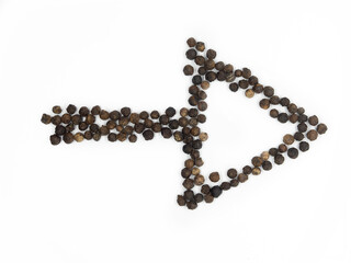 Black pepper arrow in right direction. Isolated tasty, background herb, spice arrows,  peppercorn for social media banner.
