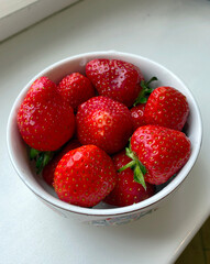 Cup of ripe red strawberries