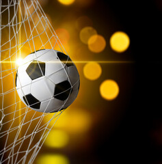 soccer ball in goal with spotlight