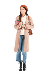 Beautiful young woman with books on white background