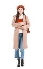 Beautiful young woman with books on white background