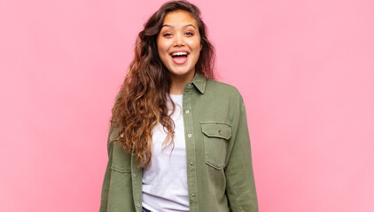  looking happy and pleasantly surprised, excited with a fascinated and shocked expression