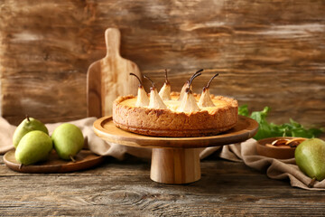 Stand with tasty pear cake on table