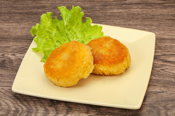 Vegan cuisine - Potato cutlet in the plate
