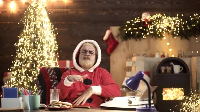 Crazy Santa Claus sing rap or Hip Hop at home near Christmas tree. New Year Holiday. Funny Repper.
