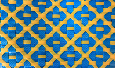 Yellow and blue patterned plastic wall panels texture.