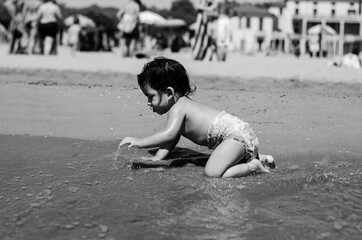 child playing on the beach