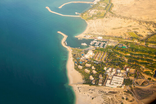 Beautiful cityscape of Dubai from aeroplane window.