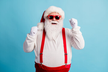 Fototapeta na wymiar Portrait of his he nice attractive funky glad lucky cheerful white-haired Santa rejoicing having fun good luck newyear festival isolated over bright vivid shine vibrant blue color background