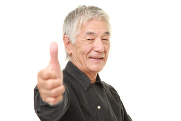 senior Japanese man with thumbs up gesture

