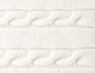 Knitted wool background. White texture knitted wool sweater