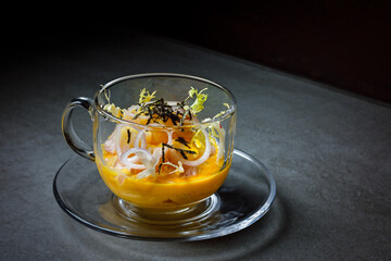 Fusion ceviche sea bass with onion, coriander, chili, and tiger's milk