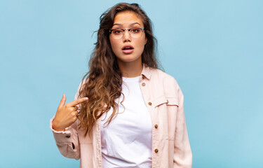  looking shocked and surprised with mouth wide open, pointing to self