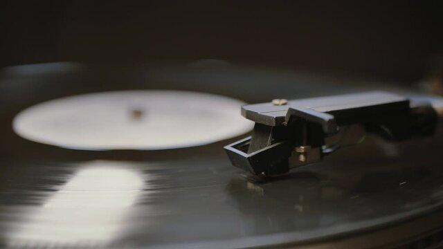 Cinemagraph vinyl record is spinning. Old retro turntable.turntable stylus on a record
