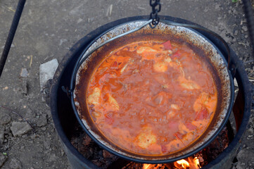 tasty goulash cooked in the cauldron 