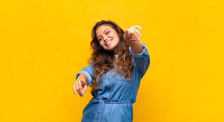  feeling happy and confident, pointing to camera with both hands and laughing, choosing you