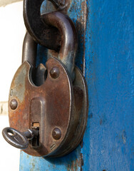 an old padlock with a key inside.