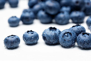 Blueberry fruit macro with dew drops background. 