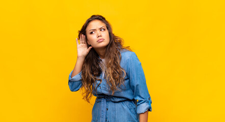  looking serious and curious, listening, trying to hear a secret conversation or gossip,...
