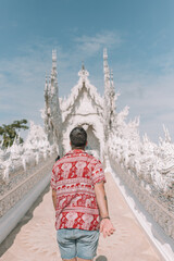 Backpacker at temple in Thailand