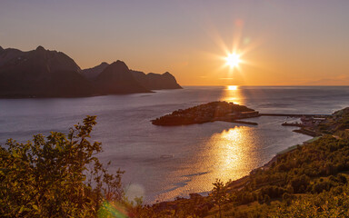 Sunset over the fishing village Husoy in Troms county. Island of Senja, Norway.