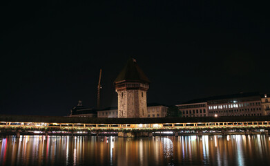 Fototapeta na wymiar Bridge over lake with a big castle in the middle,Lucerne Switzerland