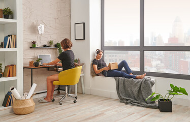 Girls working at home and living room style.