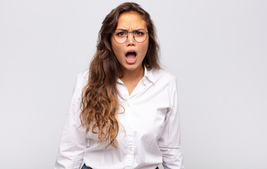  feeling terrified and shocked, with mouth wide open in surprise