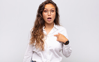  looking shocked and surprised with mouth wide open, pointing to self