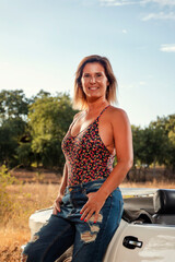 Woman with white convertible vintage car