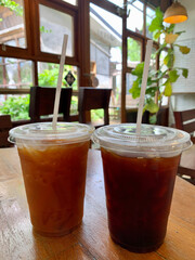 Coffee in take a way cup￼ On wooden table￼
