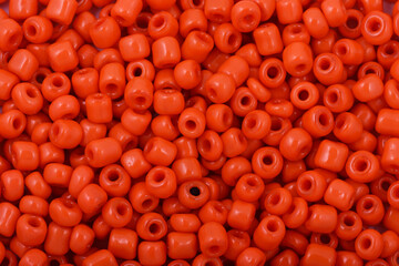 Red Beads on the white background. Background or texture of beads. Close up, macro,It is used in finishing fashion clothes. make bead necklace or string of beads for woman of fashion.