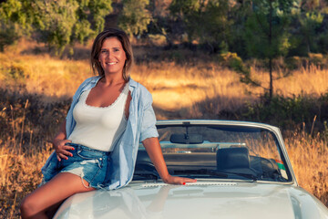 Woman with white convertible vintage car