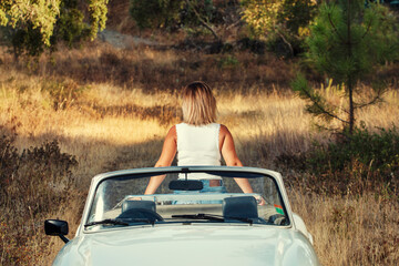 Woman with white convertible vintage car
