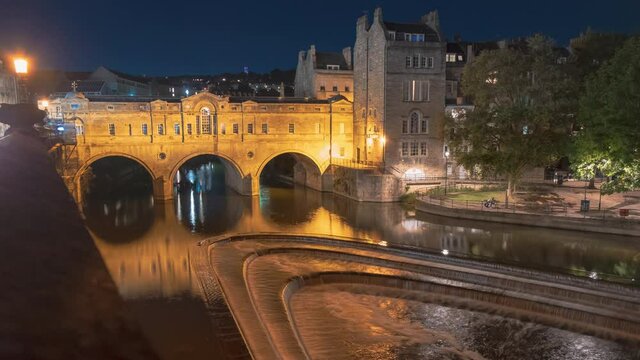 Impressive night timelapse shot of Pulteney Bridge crossing the River Avon in Bath, Somerset, England, UK, completed in 1774