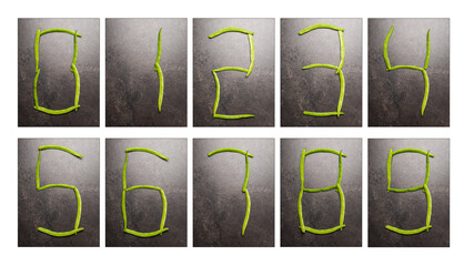 Collection of the numbers zero to nine in digital digits laid out by green beans on dark table surface