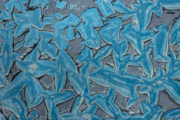 Iron covered with old blue peeling paint. Rusty metal wall. Texture. Background.