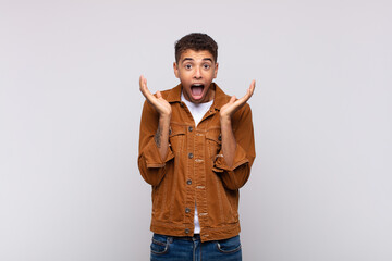  feeling shocked and excited, laughing, amazed and happy because of an unexpected surprise