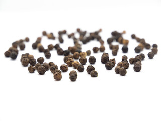 Black pepper background, herbs, spices in front view.