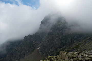 Mountain pass in the fog. Kabardino-Balkarian natural reserve. Caucasus, Russia.