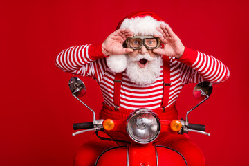 Photo of funky retired old man moped ride open mouth hold eyewear incredible speed wind wear santa...