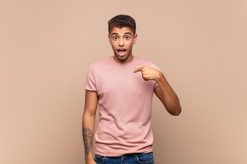  looking happy, proud and surprised, cheerfully pointing to self, feeling confident and lofty