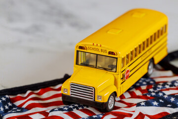 School bus and american flag background