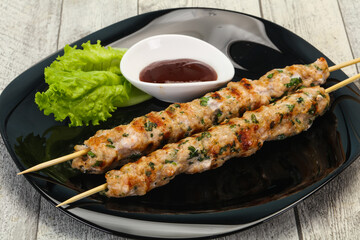Minced pork skewer kebab with sauce