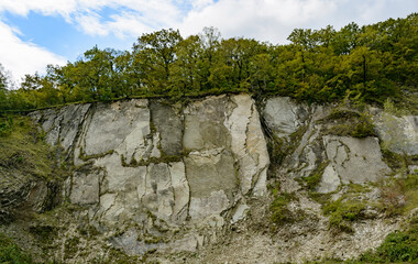Beautiful mountain range in summer against a blue sky with clouds. blurry focus