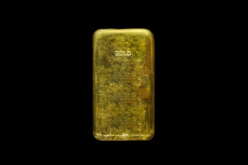 Gold bar bullion ingot cut out and isolated on a black background stock photo Image