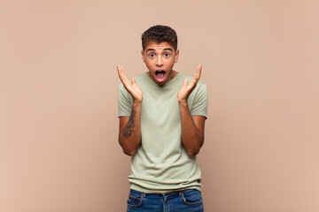  feeling shocked and excited, laughing, amazed and happy because of an unexpected surprise