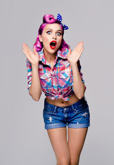 Unbelievable news! Excited surprised, very happy or scared purple red hair woman. Pinup girl with...
