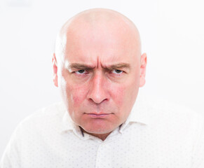 Fototapeta premium portrait of bald adult mature man with emotions on white background