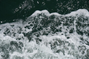 Seafoam or spume on seawater stock photo